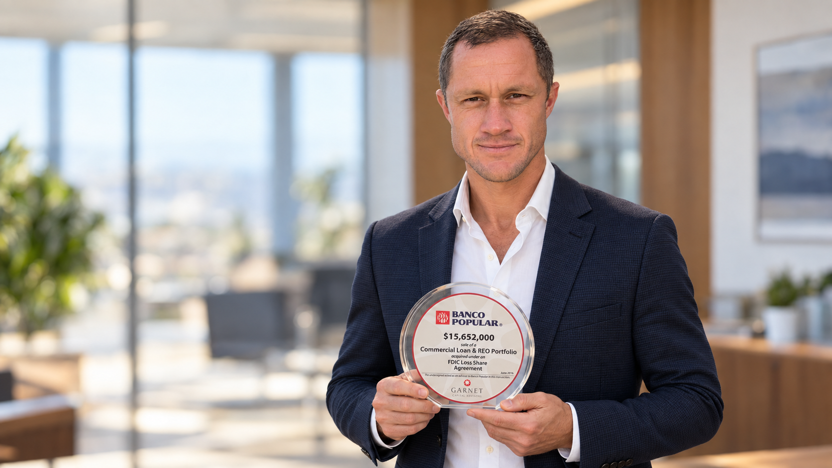 Founder Joe Robert holding a Banco Popular award for a $15,652,000 commercial loan and REO portfolio sale